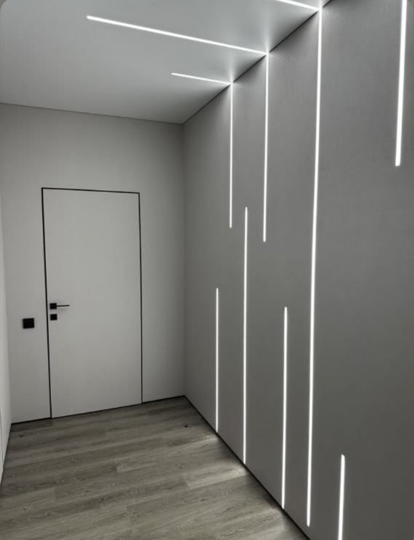 Modern wall with vertical linear LED lighting